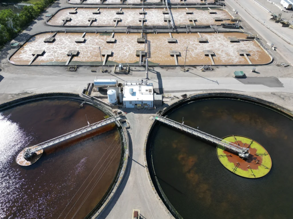 Industrial wastewater treatment system with treatment tanks and process equipment