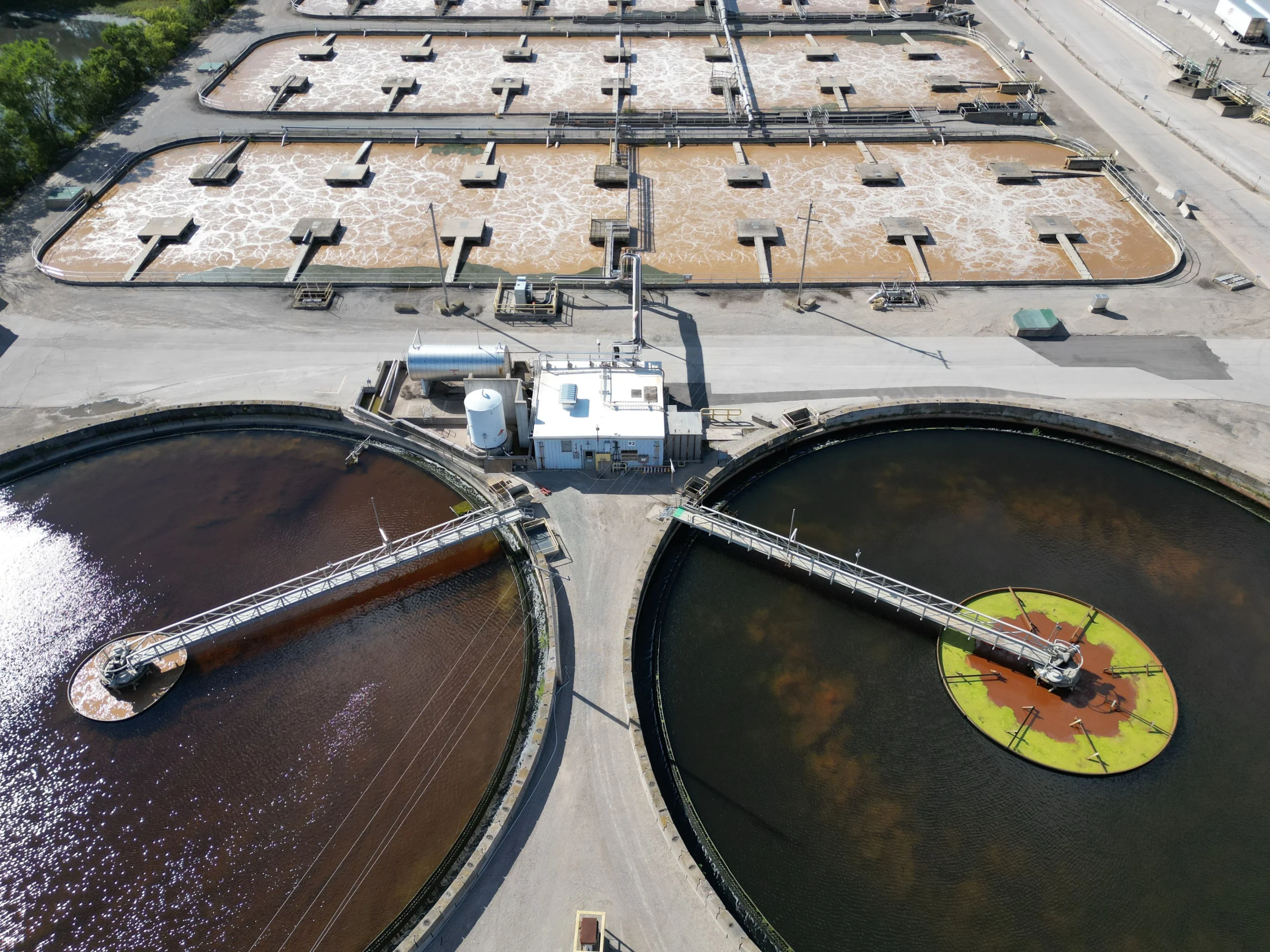 Industrial wastewater treatment system with treatment tanks and process equipment